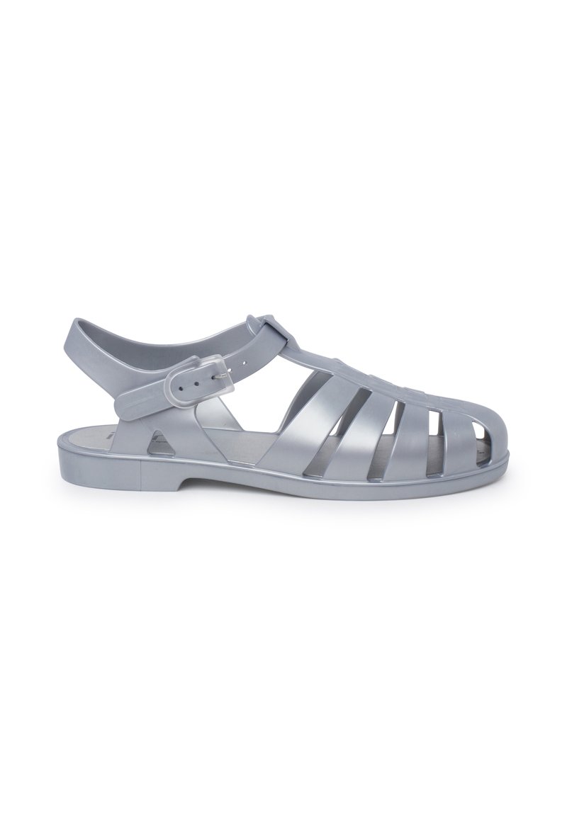 Gray plastic sandal with open design, multiple slits on the upper, ankle strap with adjustable buckle, and flat sole.