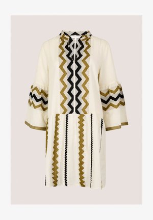 Weißes Oberteil mit Zickzackmustern in Olivgrün, Schwarz und Creme. Verfügt über ausgestellte Ärmel, einen runden Ausschnitt und eine lockere Passform.