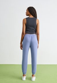 Roxy RISE VIBE PANTS - Tréningruha alsók - wild wind