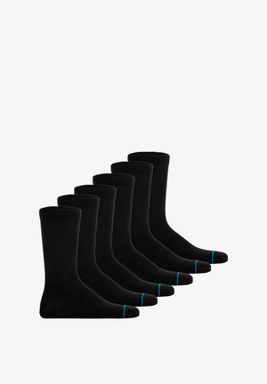 Zwarte sokken met ribbeltextuur, voorzien van een blauwe accent bij de tenen. Zes paar in een rij weergegeven, standaard lengte.