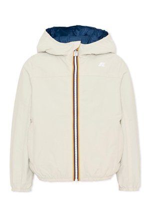 Beżowa kurtka z kapturem, elastycznymi mankietami, wielokolorowym, paskowanym zamkiem błyskawicznym i ciemnoniebieską podszewką.