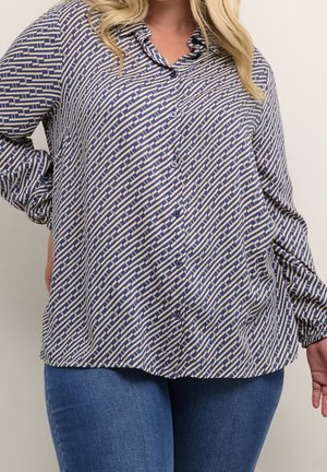Chemise à manches longues et à boutons en bleu et crème avec un motif géométrique. Présente un col et une coupe décontractée. Tissu doux avec un léger éclat.