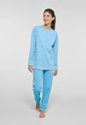Set di pigiama blu chiaro composto da una maglia a maniche lunghe con orlo in pizzo e pattina con bottoni, abbinato a pantaloni aderenti coordinati. Tessuto morbido.