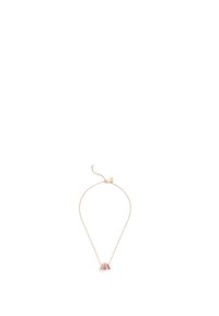 Collier en plaqué or avec une chaîne fine et un petit pendentif décoratif rouge et blanc. Design simple avec un fermoir ajustable.