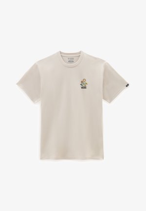 Camiseta de manga corta color crema hecha de algodón, con un gráfico floral que incluye una flor amarilla y la palabra "VANS" en negro debajo de ella.