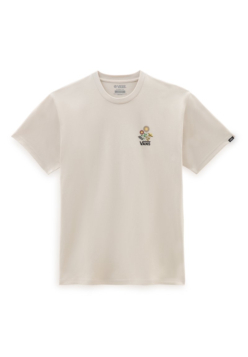 Camiseta de manga corta color crema hecha de algodón, con un gráfico floral que incluye una flor amarilla y la palabra "VANS" en negro debajo de ella.