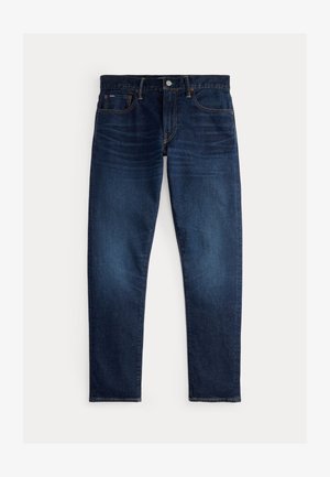 Tmavě modré džínové kalhoty s přímočarým střihem, vybavené klasickým uspořádáním pěti kapes a kontrastním prošíváním. Viditelné zapínání na přední knoflíky.