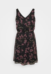 Svart blommig klänning i lättviktig tyg. Har en V-ringning, är ärmlös, har cinchad midja och rosa blommönster över hela.