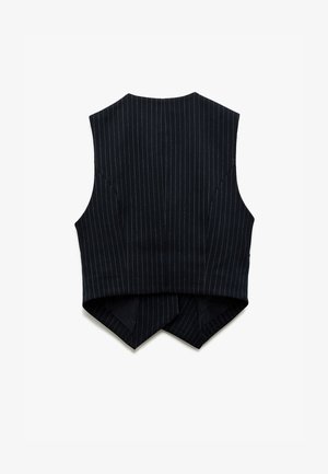 Mouwloze cropped top in donkerblauwe stof met witte strepen. Bevat een spitse achterzoom en op maat gemaakte details.