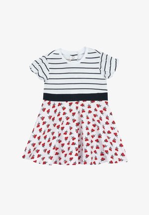 Vestido de bebé de manga corta con rayas horizontales negras en la parte superior, cinturilla negra y falda blanca con patrones de corazones rojos.