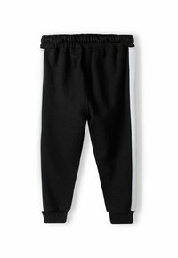 Zwarte sweatpants met een elastische tailleband en boorden, met witte zijkanten voor contrast. Gemaakt van zacht, gestructureerd stof.