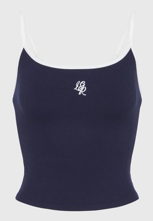 Marineblå ribbet crop top med hvite stropper og brodert logo. Har en tettsittende design og en glatt tekstur, passende for hverdagsbruk.