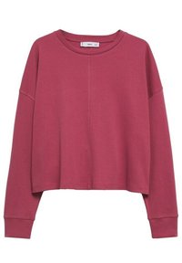 Sweat-shirt cropped à manches longues de couleur rose doux, avec un col rond et un détail de couture centrale.
