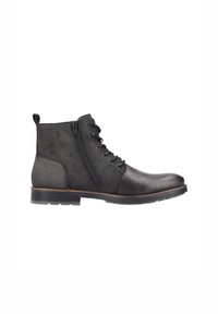 Botas negras hasta el tobillo, hechas de cuero y ante, con cremallera lateral, punta redonda y suela de goma texturizada. Acentuadas con un borde cosido en marrón.