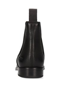 Botte cheville en cuir noir avec un dessus texturé, des panneaux élastiques sur les côtés et une languette à l'arrière. Semelle en caoutchouc robuste.