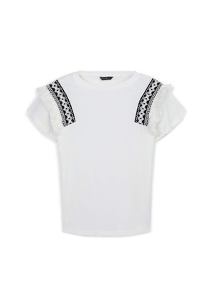 T-shirt bianco a maniche corte, con bordo decorato in nero e frange bianche sulle spalle. Tessuto morbido con una vestibilità comoda.