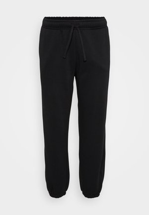 Black sweatpants made from a soft, stretchy fabric. Designed with an elastic waistband, adjustable drawstring, and tapered cuffs.