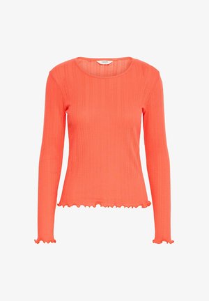 Korallivärvi pika varrukaga topp ribbekandiga tekstuuriga. Omab ümmargust kaelust ning volangiliste servadega mansetid ja äär. Kerge kangas.