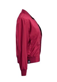 Red bomber jacket made of smooth nylon with a front zipper, ribbed cuffs and hem, and side pockets. Features a small logo on the hem.