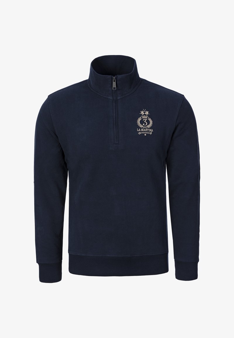 Tmavě modrá mikina s čtvrtým zipem z měkké látky. Má logo na hrudi, žebrované manžety a hladkou texturu.