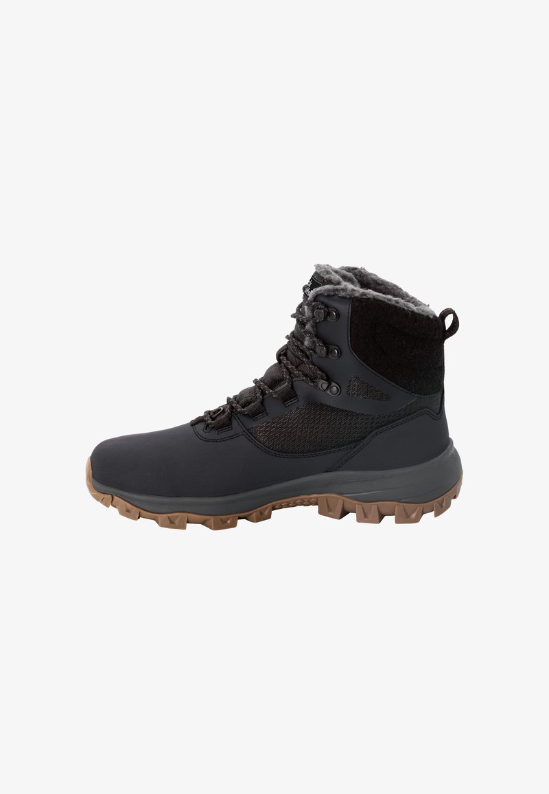 Zwarte waterdichte boots met een getextureerde bovenkant, grijze fleece voering en een robuuste rubberen zool met multidirectionele gripnoppen.