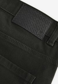 Next SOFT TOUCH STYLE - Traperice suženog kroja - mottled olive