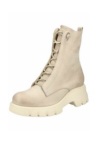 Stivale alla caviglia in pelle beige con chiusura lacci, dettagli in tessuto e suola spessa in gomma bianca, caratterizzato da cuciture lungo le cuciture.