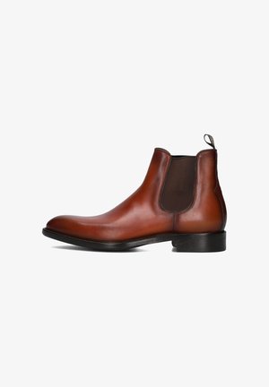 Botte Chelsea en cuir brun avec des panneaux élastiques sur les côtés, bout arrondi et talon léger. La texture lisse et les lignes épurées caractérisent le design.