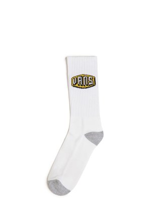 Weißer Crew-Socke mit geribbelter Textur, ausgestattet mit einem gelben und schwarzen Vans-Logo im oberen Teil und einer grauen verstärkten Ferse und Spitze.