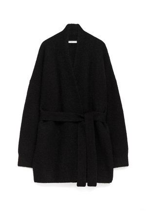 Zwarte open voorzijde cardigan gemaakt van zacht, textuurstof. Beschikt over een strikceintuur en brede mouwen, met een ontspannen silhouet en zonder sluitingen.