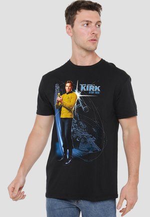 Black t-shirt featuring a graphic of a character in a yellow uniform, with blue and white accents, reminiscent of a sci-fi theme.