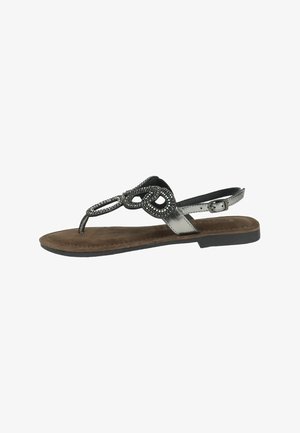 Infradito metallici argento con decorazioni in perline nere, cinturino alla caviglia regolabile e una soletta marrone a texture. Design con suola piatta.