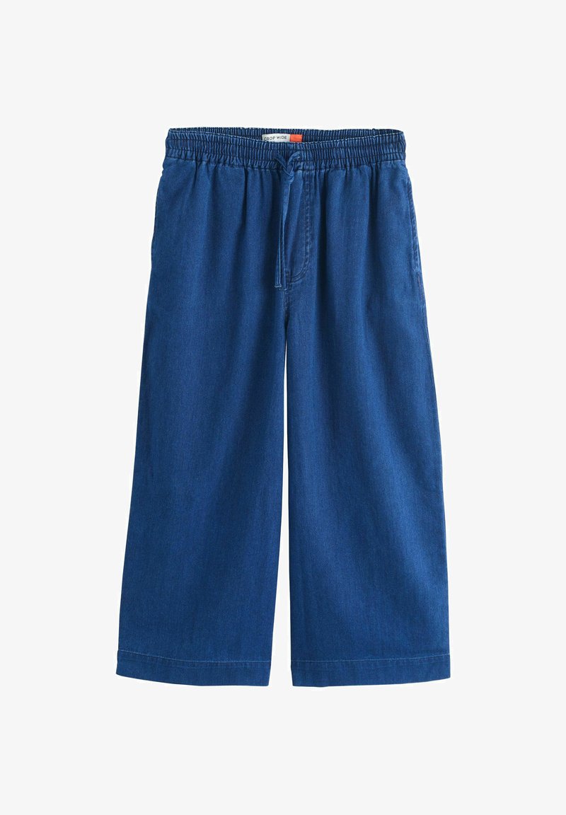 Pantalon en denim bleu à jambes larges, coupé au-dessus de la cheville, avec taille élastique et fermeture à cordon frontal.