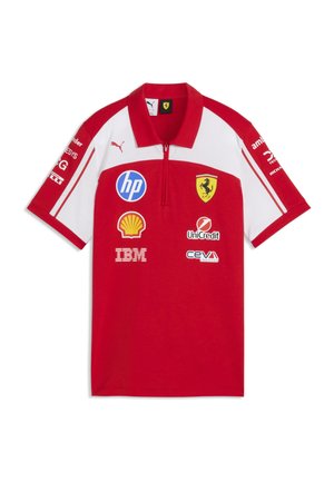 Polo Ferrari rosso e bianco con logo Puma e loghi degli sponsor tra cui HP, Shell, IBM, UniCredit e Ceva Logistics.