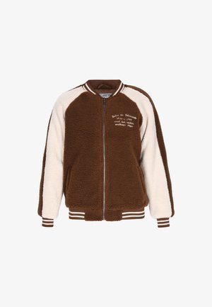 Pruun ja kreemikirjuline fliisjakke, millel on lukuga kinnitamine, soonikkoes mansetid ja äär. Esiküljel on dekoratiivne tekst ja kontrastsete varrukatega.