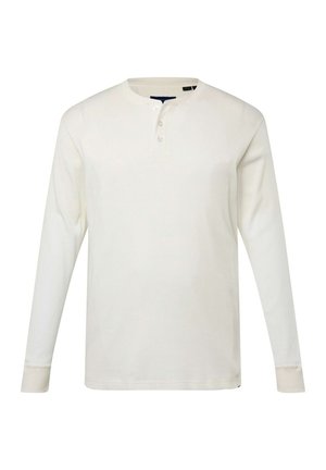 Bílá dlouhá rukávová henley košile vyrobená z žebrované látky, která má kulatý výstřih, zpevnění se třemi knoflíky a přiléhavé manžety.