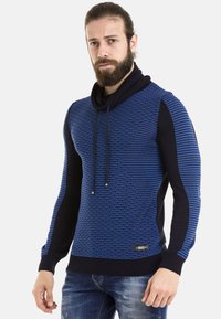 Blauer und schwarzer Pullover mit einem strukturierten Webmuster, einer Kapuze mit Kordelzügen und gerippten Bündchen für eine optimale Passform.