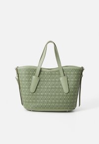 Green patterned tote bag with textured synthetic material, rounded top, two matching handles, and a detachable shoulder strap.