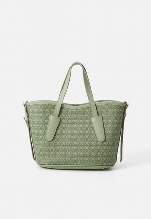 Green patterned tote bag with textured synthetic material, rounded top, two matching handles, and a detachable shoulder strap.