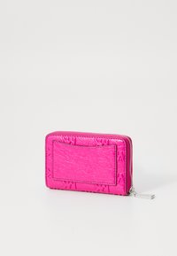 Pink textured wallet with a zip closure, featuring a front ID slot and metallic detailing. Compact, rectangular shape with a crinkled finish.