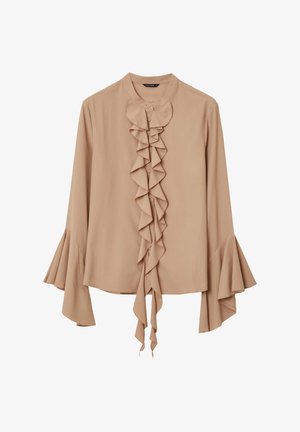 Blusa beige con maniche lunghe, dettaglio arricciato sul davanti e polsini a campana. Realizzata in tessuto leggero, presenta bottoni e un laccio.