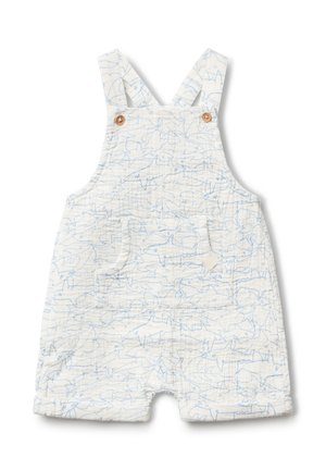 Mono de tela blanca con estampado de peces azules, con dos tirantes ajustables, botones de madera y un bolsillo frontal. Diseño corto.
