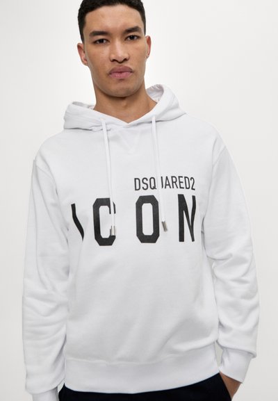 Sweatshirt à capuche blanche en tissu doux, arborant un graphique noir audacieux "ICON" et le logo "DSQUARED2" sur le devant, avec des cordons de serrage.