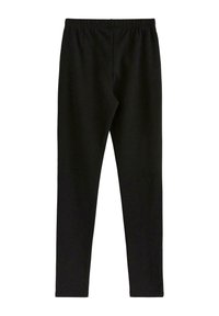 Mustat leggingsit pehmeästä kankaan materiaalista, joissa on joustava vyötärö. Muotoilu on vartalonmyötäinen, sileäpintainen eikä siinä ole ylimääräisiä koristeita.