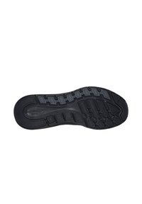 Suola di scarpa in gomma nera con un motivo di grip testurizzato e un design curvo. Dettagli notevoli includono forme esagonali e scanalature flessibili.