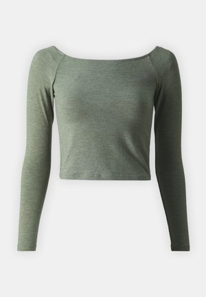 Aineroheline pika varrukaga crop top ruudukujulise kaelusega. Valmistatud pehmest, tekstureeritud kangast, millel on istuvad varrukad ja puhas äär.