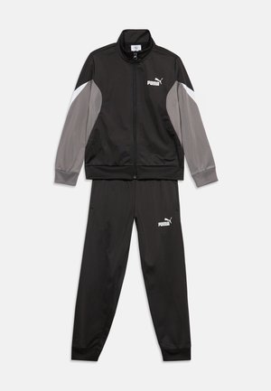 Μαύρη φόρμα Puma με ζακέτα με φερμουάρ που έχει γκρι και λευκά μπλοκ χρώματος στα μανίκια και ταιριαστό μαύρο παντελόνι με λογότυπο.