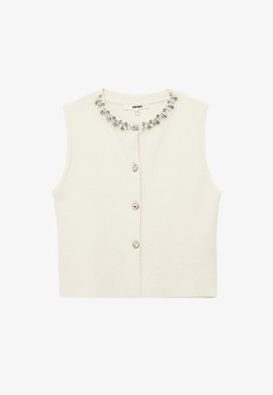 Crèmekleurig mouwloos topje met een ronde hals, versierd met een decoratieve kristallen halslijn en knoopsluitingen aan de voorkant. Zachte gebreide textuur.