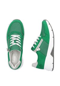 Green sneakers with mesh and suede material, featuring white laces, a silver zipper accent, and a textured gray sole.