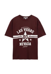 Burgundy puuvillasta tehty t-paita, jossa on valkoinen graafinen teksti "LAS VEGAS" ja "NEVADA" tähden ja perustamisvuoden kanssa. T-paidassa on lyhyet hihat ja rento malli.